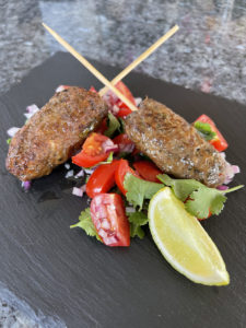 Lamb koftas with tomato and onion salad