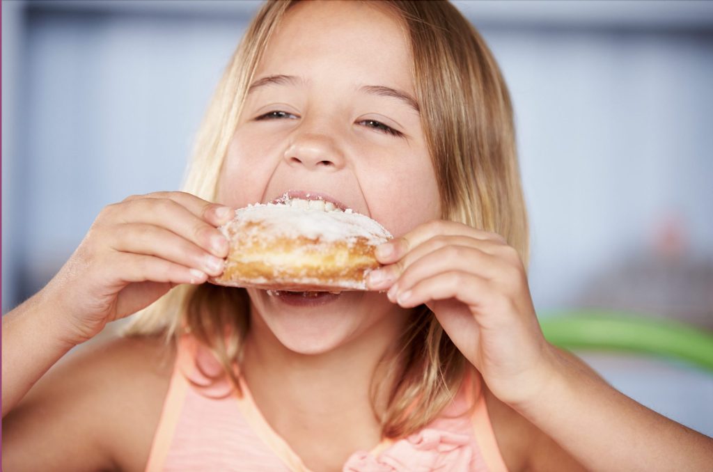 Sugar Awareness Week Girl eating a pastry
